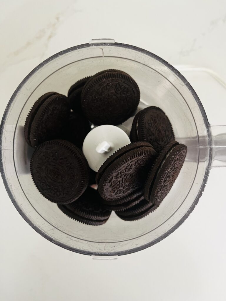 Oreo cookies in a food processor on the counter