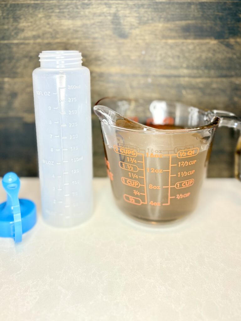 simple syrup in a measuring cup cooling on a counter