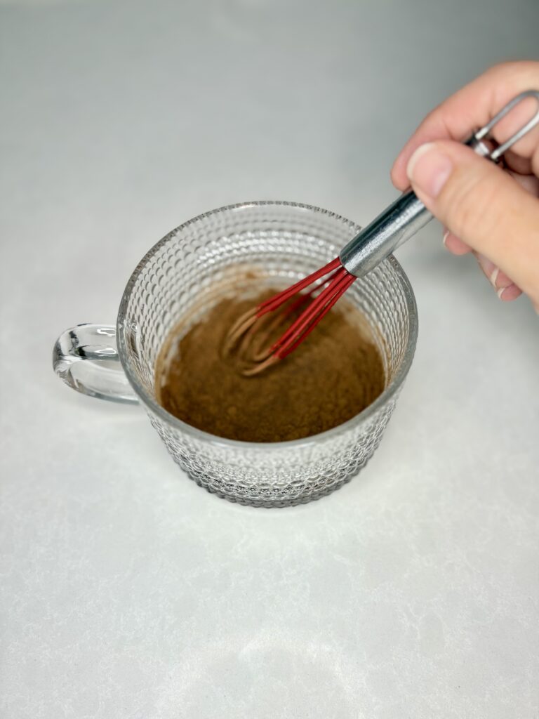 cocoa and simple syrup being whisked