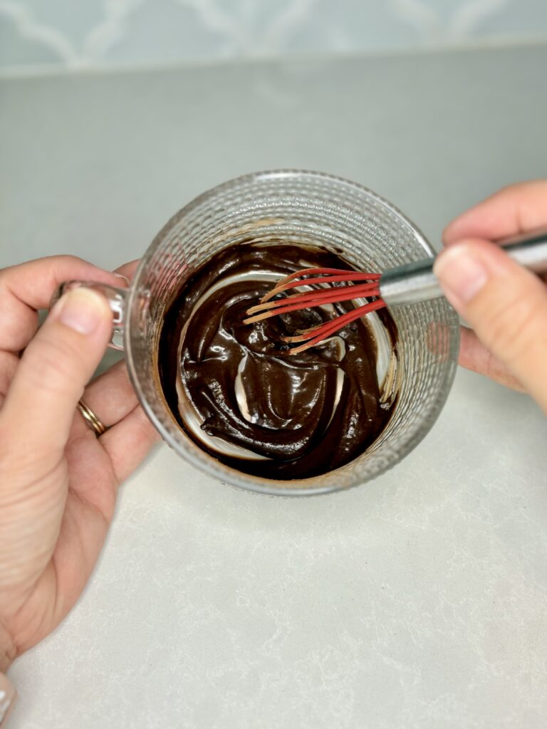 smooth mixture of simple syrup and cocoa powder