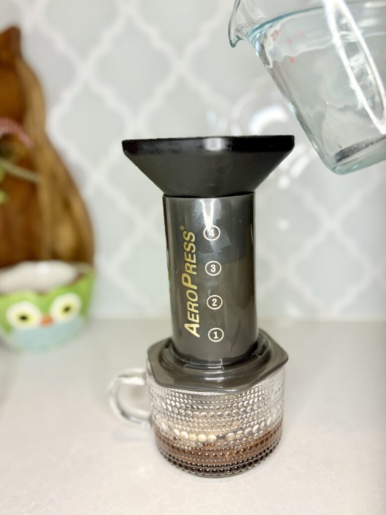 water being poured into AeroPress