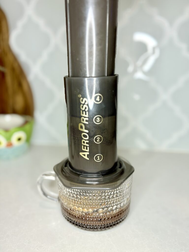 coffee being pressed in AeroPress