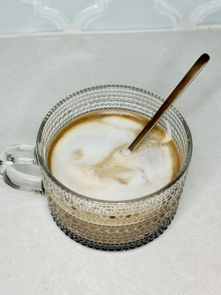 a mochaccino in a mug with a spoon