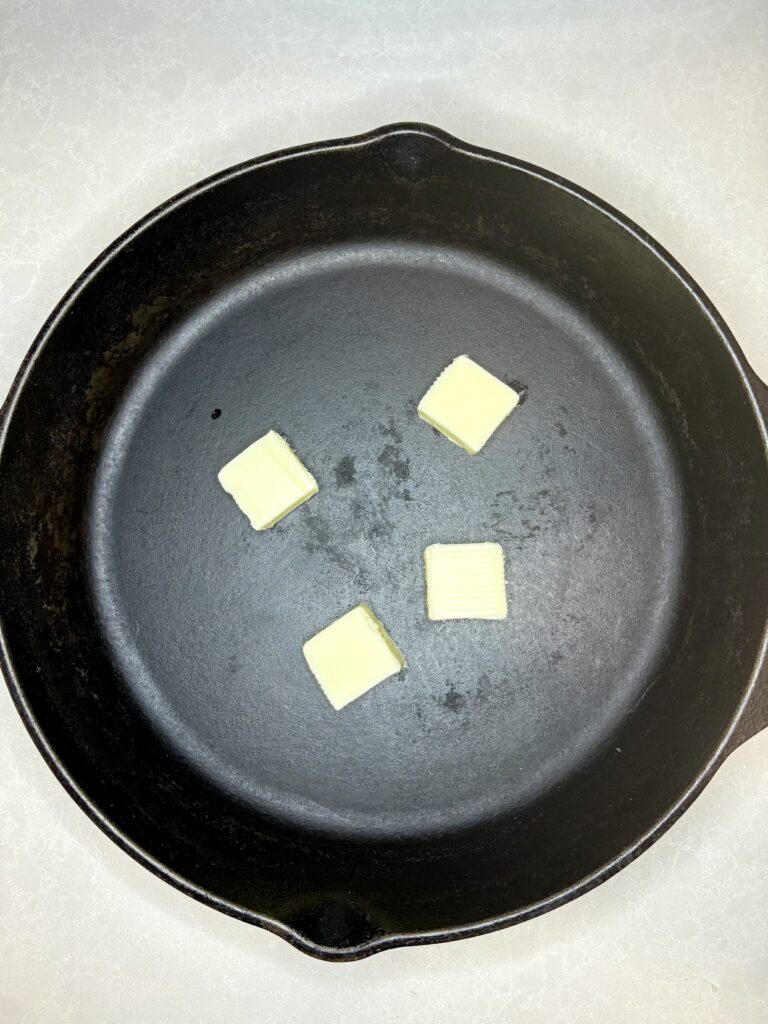 chopped butter in a cast iron skillet