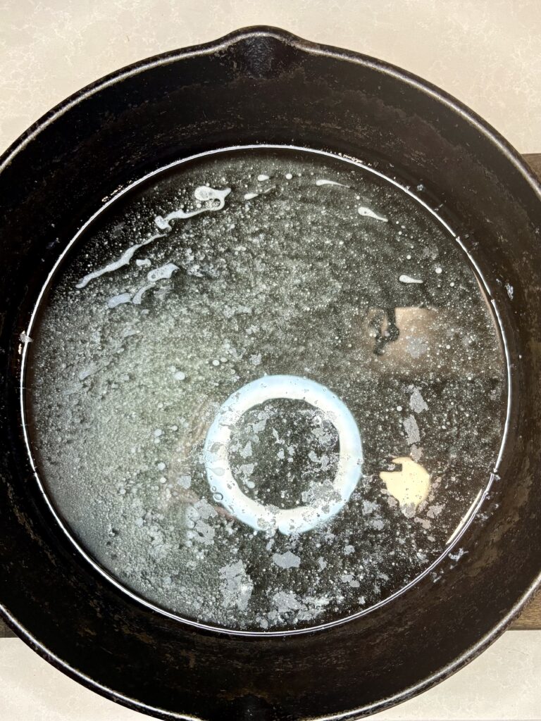 melted buter in a cast iron skillet 