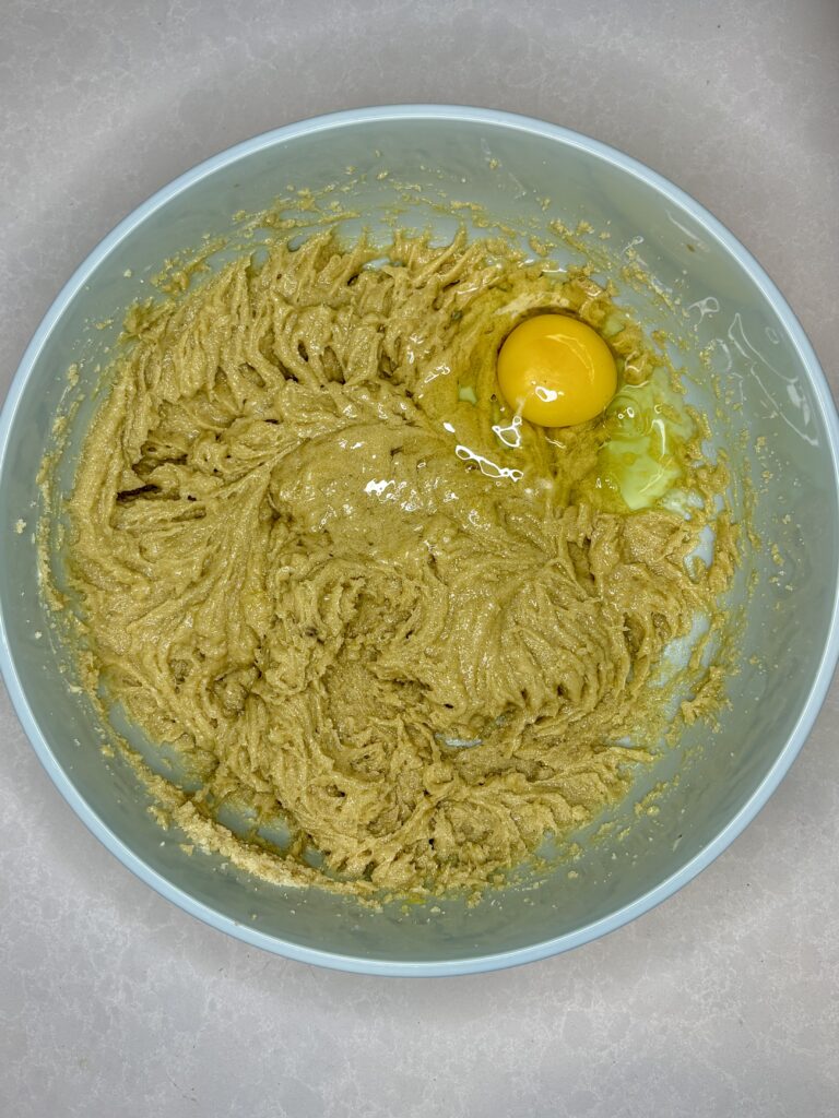 an eggg in a bowl with dough