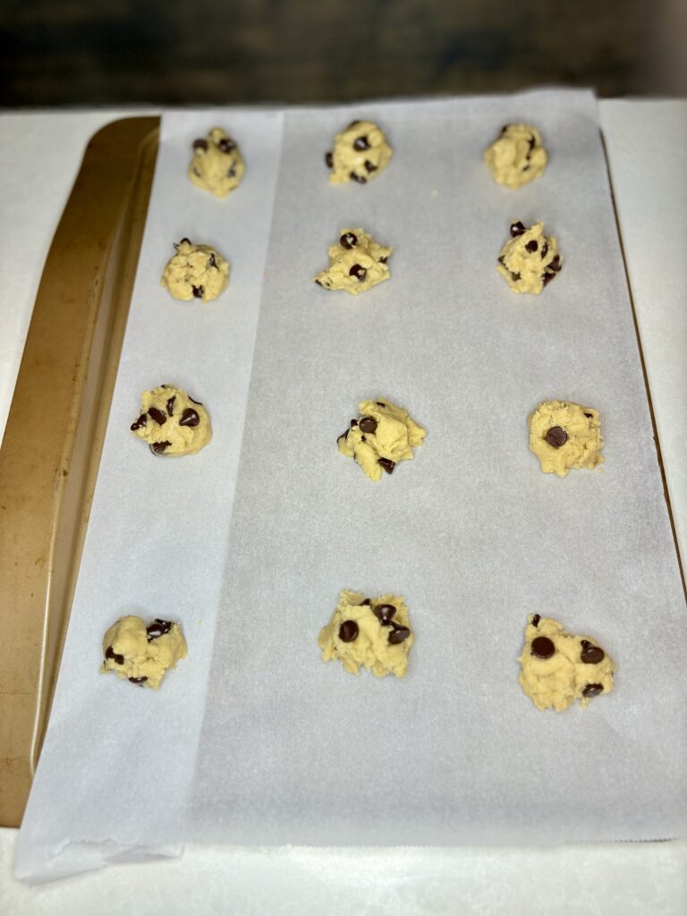 scoops of dough on a baking sheet