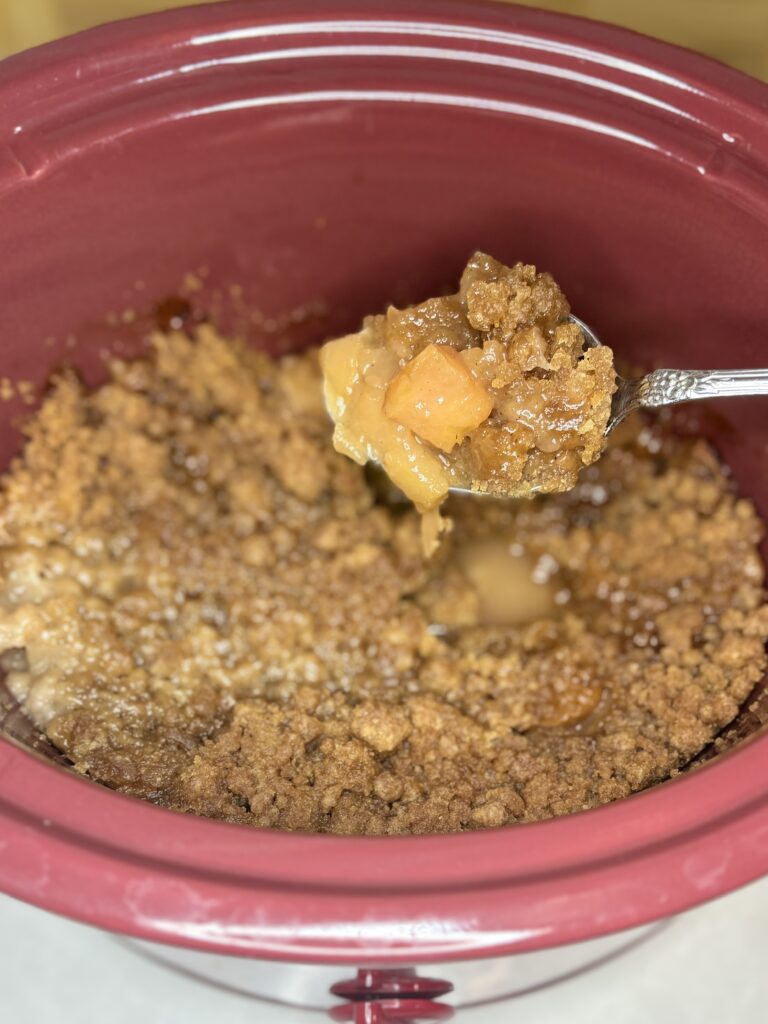 cooked cinnamon streusel apples in a slow cooker