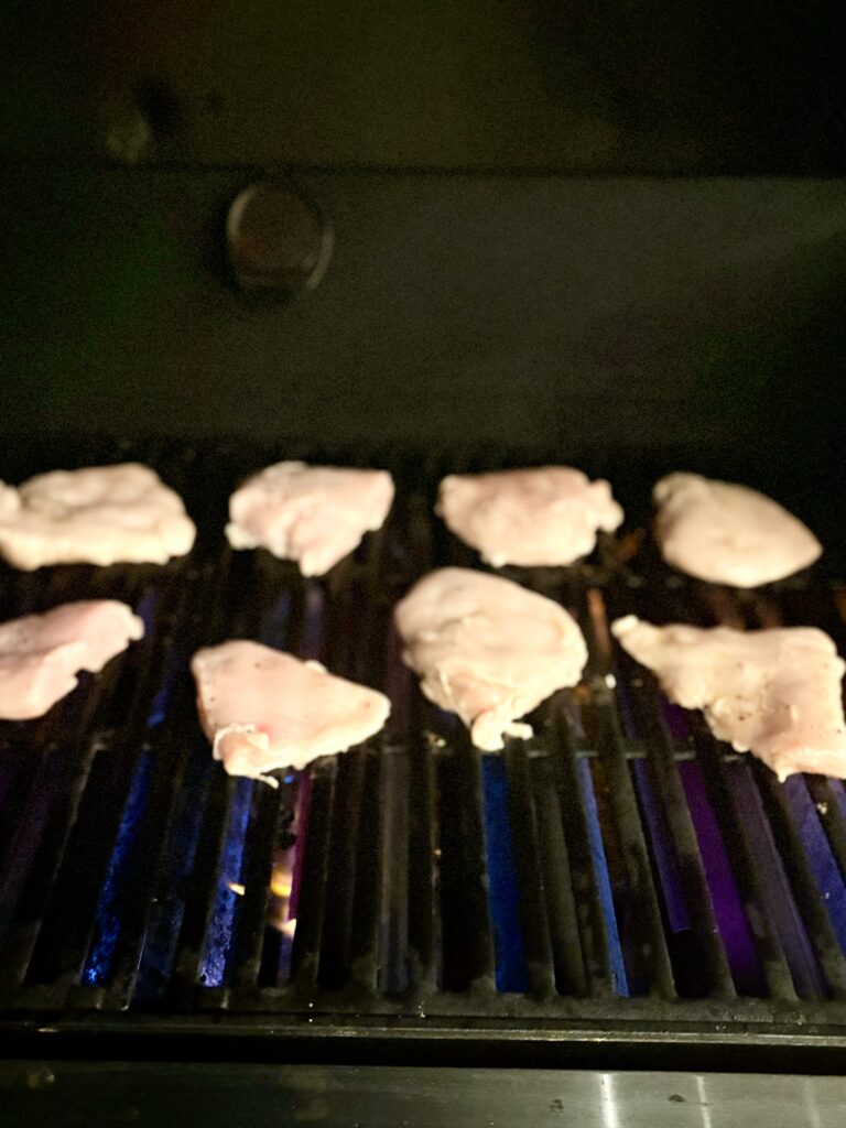 raw chicken on a grill