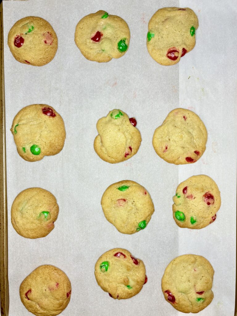 baked cookies on a cookie sheet lined with parchment paper