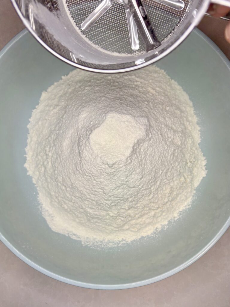 a bowl with sifted flour and salt