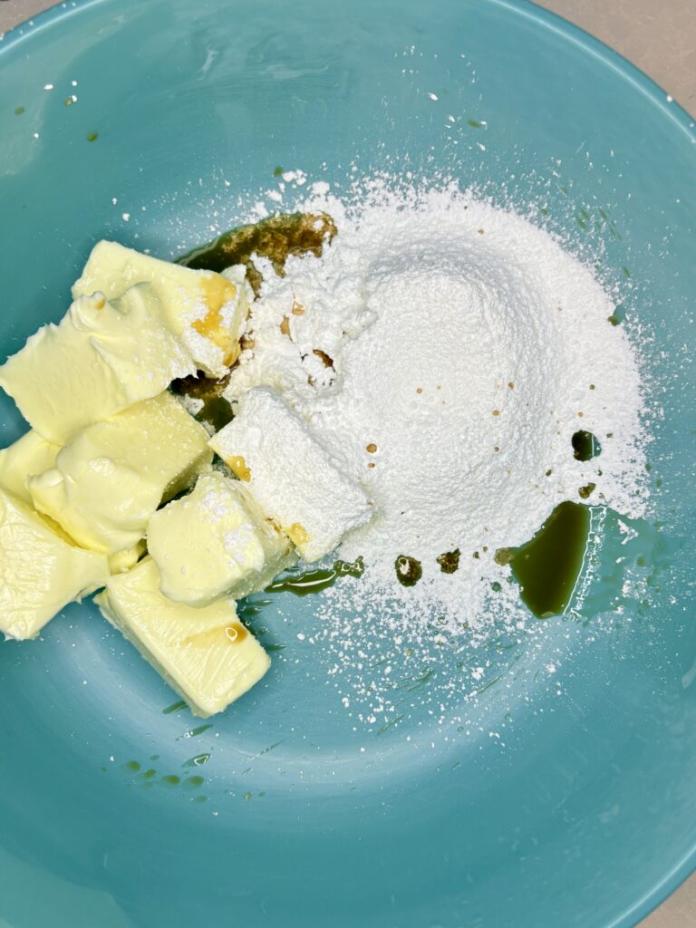 butter, powdered sugar and vanilla in a bowl