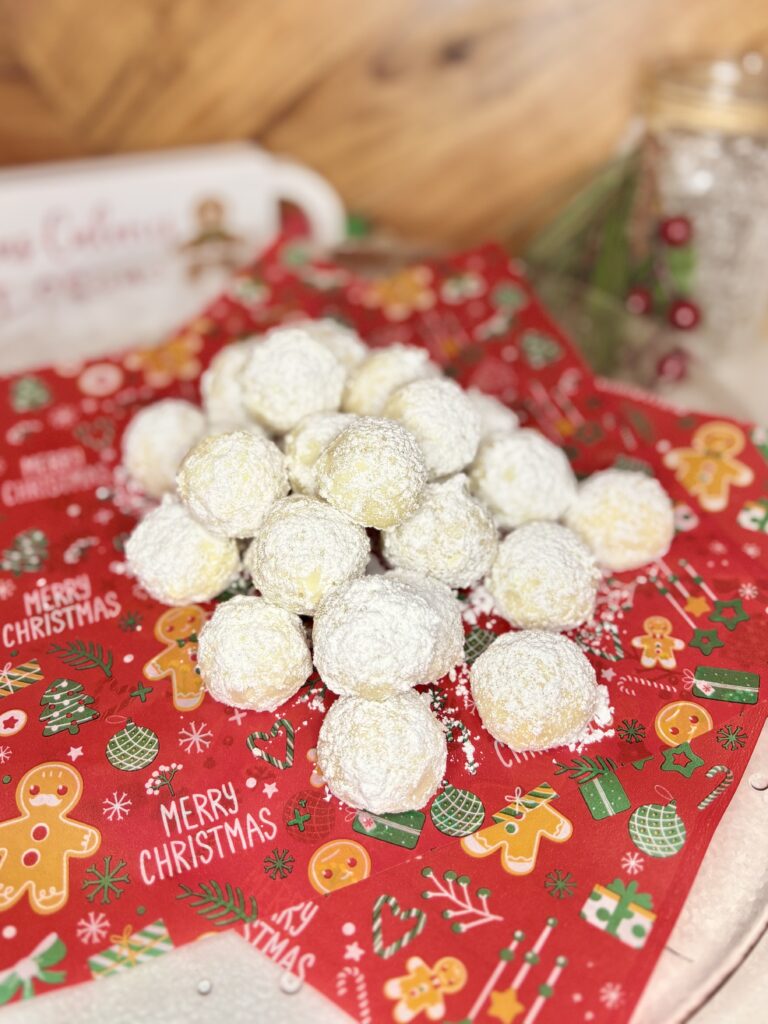 russian tea cakes on a plate on a counter