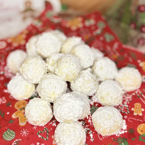 russian tea cakes on a plate on a counter