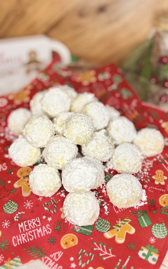 russian tea cakes on a plate on a counter