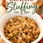 Delicious classic stuffing in a white bowl with herbs and a side of cranberry sauce, perfect for holiday dinners.