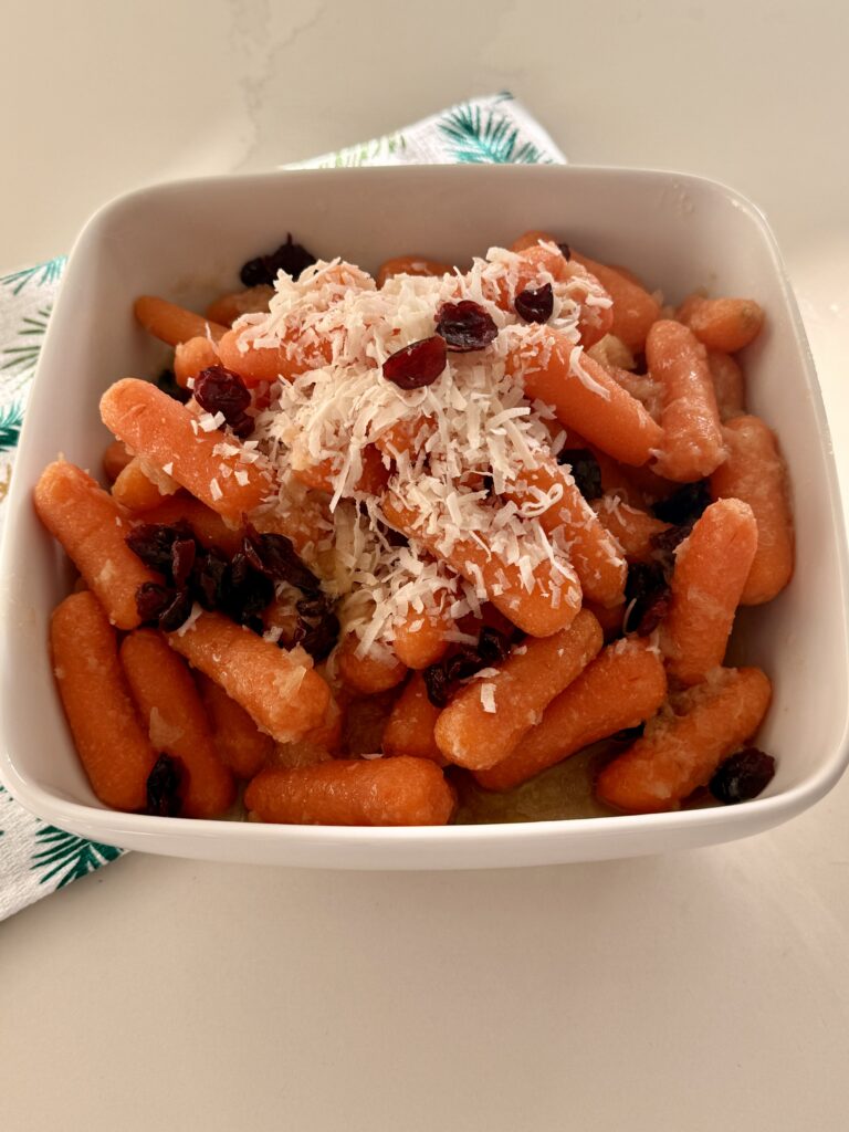 Christmas Glazed Carrots in a white bowl on counter