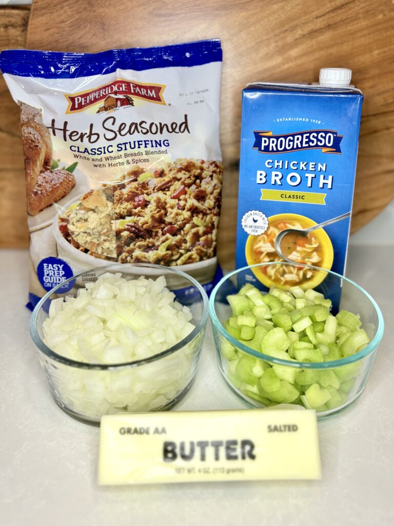 butter, celery, onion, stuffing mix, and chicken broth on a counter