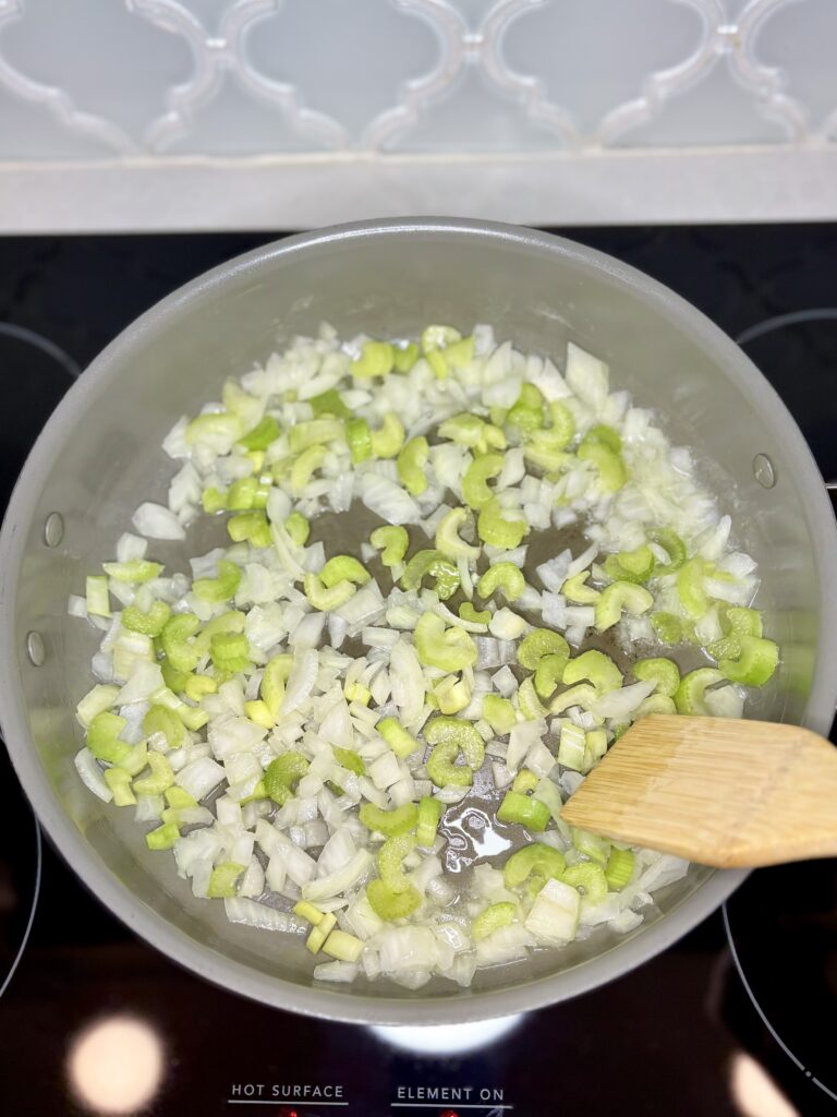 celery and onion cookie in a pan on a stove