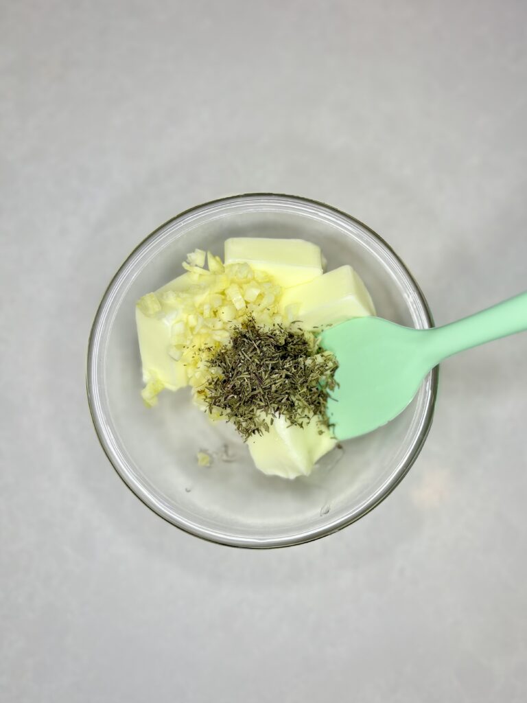 softened butter, garlic and thyme in a bowl