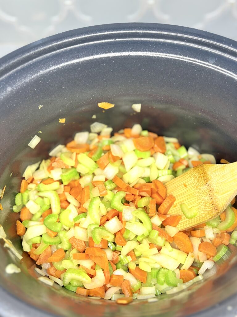 vegetables being cooked in a pot