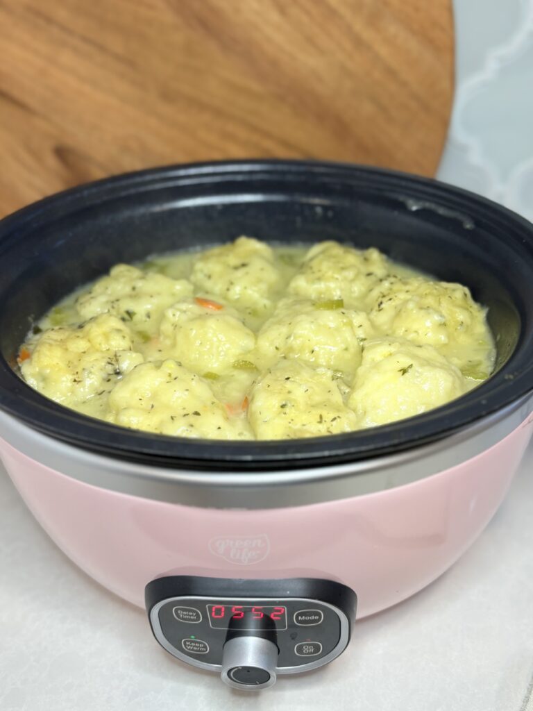 cooked chicken and dumplings in a slow cooker