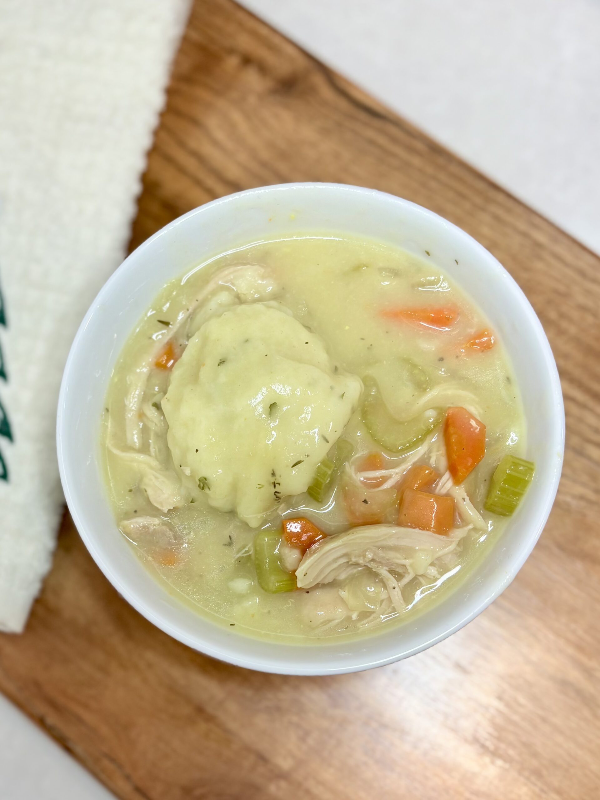 chicken and dumplings in a bowl on a counter