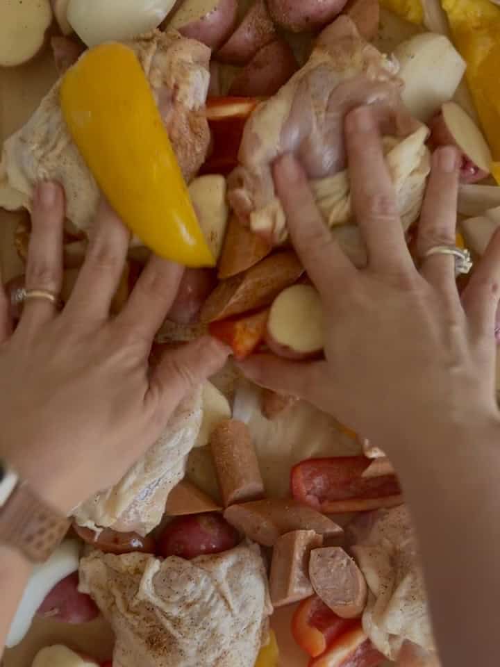 Delicious chicken and andouille sausage sheet pan dinner with colorful vegetables, perfect for easy weeknight meals and flavorful comfort food.