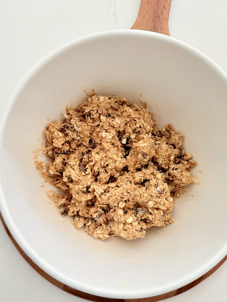 Mix ingredients in a large white mixing bowl on the counter.