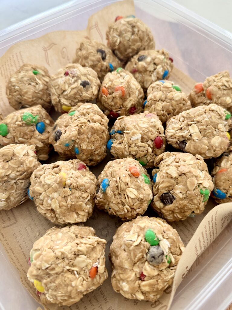 Monster Energy Bites in a plastic container on the counter.