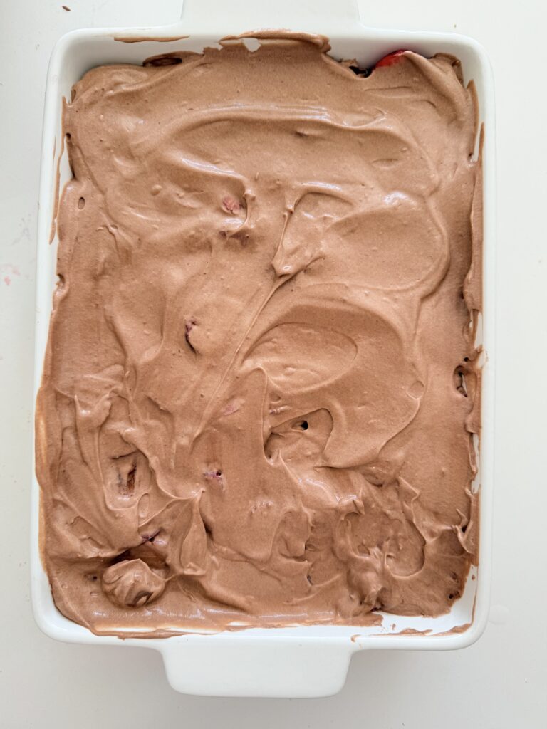 Chocolate pudding in a white baking tray on the counter.