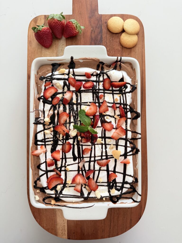 No Bake Strawberry Chocolate dessert on a brown tray on the counter.