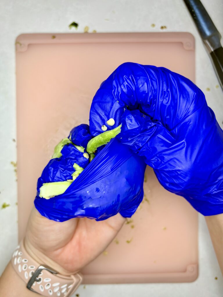 jalapeno pepper guts being wrapped in used glove