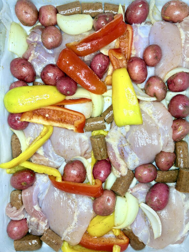 chicken, sausage, and vegetables on a sheet pan