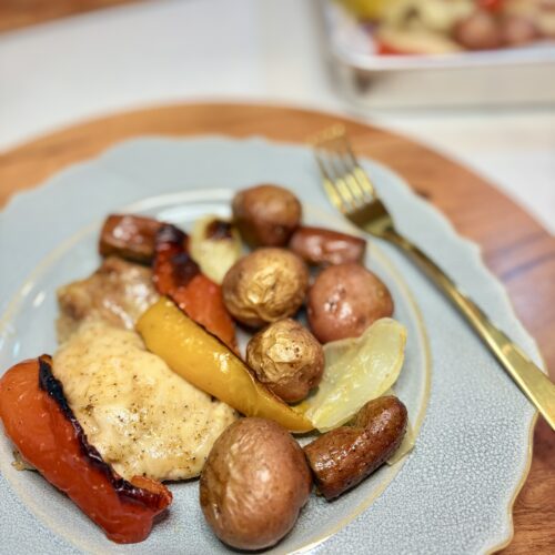 Chicken andouille sheet pan dinner on a plate on a counter