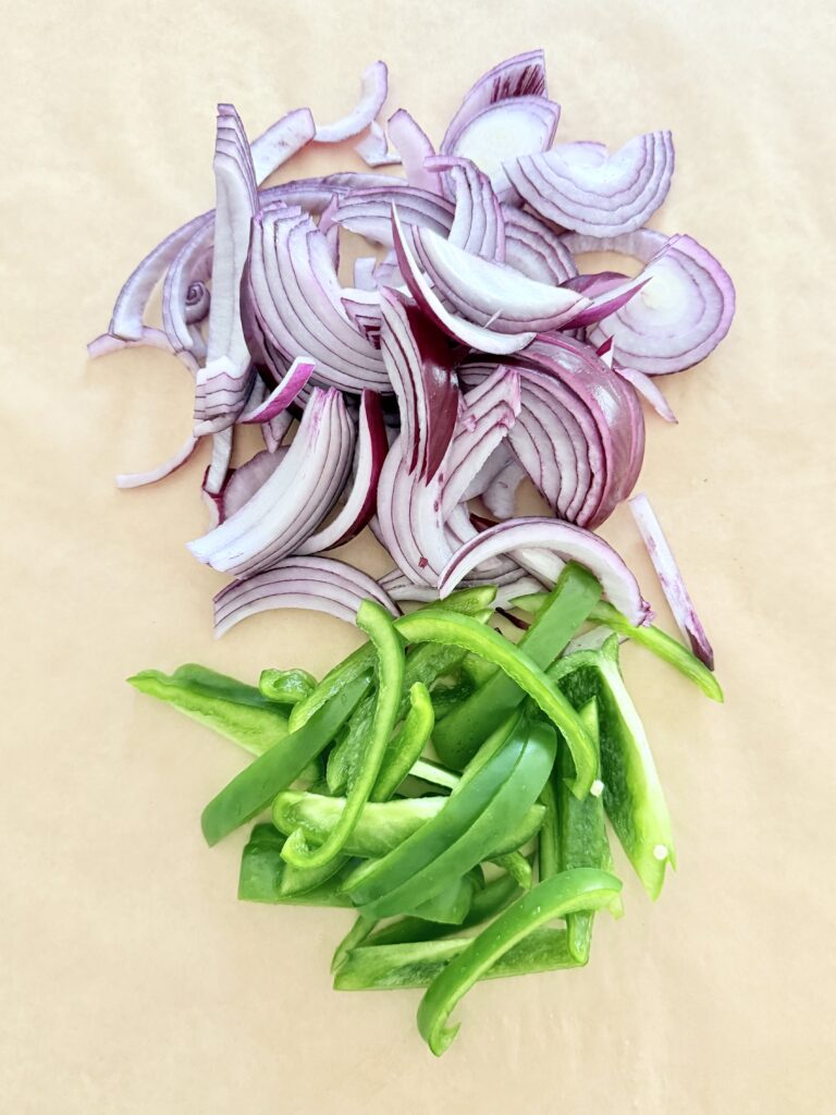 cut and thinly sliced red onion and green pepper.