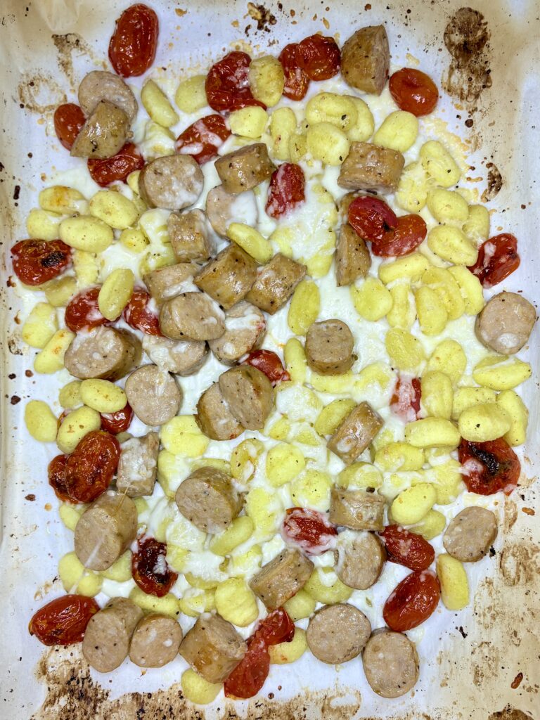 Italian sausage and gnocchi sheet pan dinner with melted cheese 