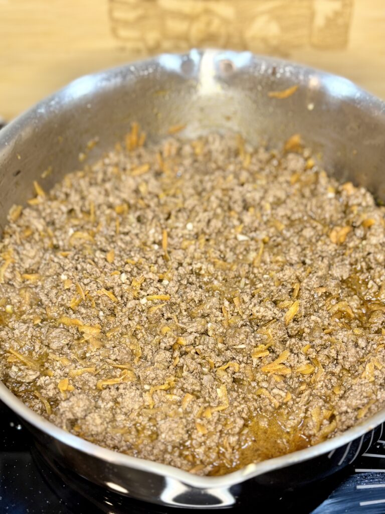 cooked ground beef mixture in a pan on a stove