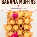 Fresh Hawaiian banana muffins arranged in paper cups with pink flowers for a tropical dessert presentation.