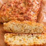 Buttermilk Bisquick cheese and garlic loaf, homemade savory bread recipe, easy cheese garlic bread, soft and flavorful bread, simple homemade bread loaf for snacking or side dish.