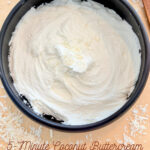 Coconut buttercream frosting in a black mixing bowl, ready to be spread on cakes or cupcakes, perfect for quick and easy dessert decoration.