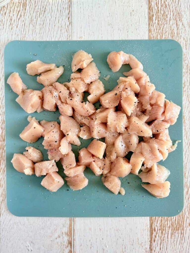 chunks of chicken seasoned with salt and pepper