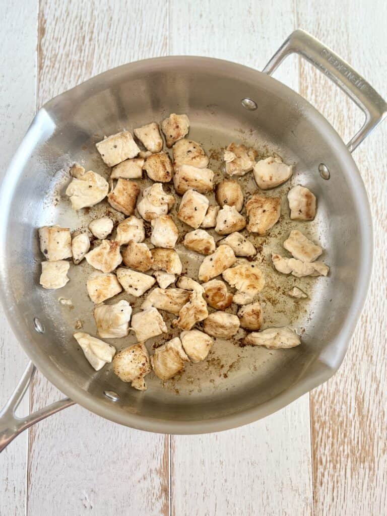 chicken chunks browning in a skillet