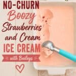 Creamy strawberry ice cream in a white rectangular dish with fresh strawberries on a wooden surface, featuring text overlay promoting no-churn boozy strawberry and cream ice cream with Baileys.