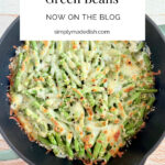 cheesy green beans in a skillet