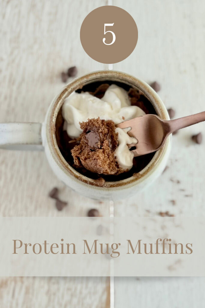 Chocolate protein mug muffins with whipped cream in a rustic mug, topped with chocolate crumbles, perfect for healthy snacking and easy breakfast options.