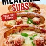 Delicious homemade meatball subs with melted cheese, fresh basil, and savory meatballs in toasted bread, perfect for a quick and tasty meal.