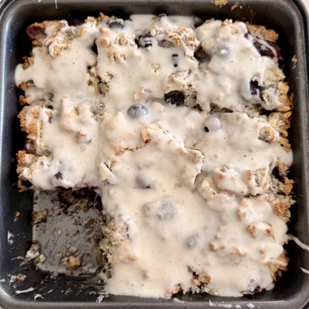 Delicious homemade blueberry squares topped with creamy glaze, made with Bisquick for a quick and easy dessert. Perfect for breakfast or a sweet snack, featuring fresh blueberries and a tender crumbly.