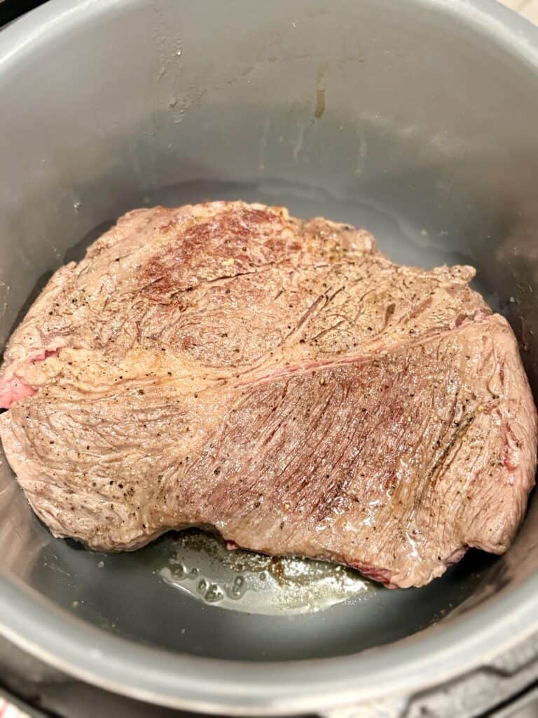 Juicy beef roast cooking in an instant pot, perfect for tender, flavorful meals. Ideal for easy dinner recipes and meal prep.