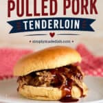 Juicy slow cooker pulled pork tenderloin sandwich with barbecue sauce on a soft bun, served on a white plate with a red cloth napkin, perfect for easy dinner recipes.